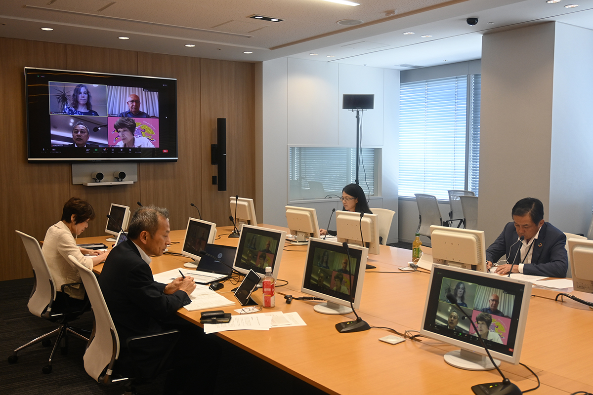 Hybrid meeting with both in-person and online participants in a conference room